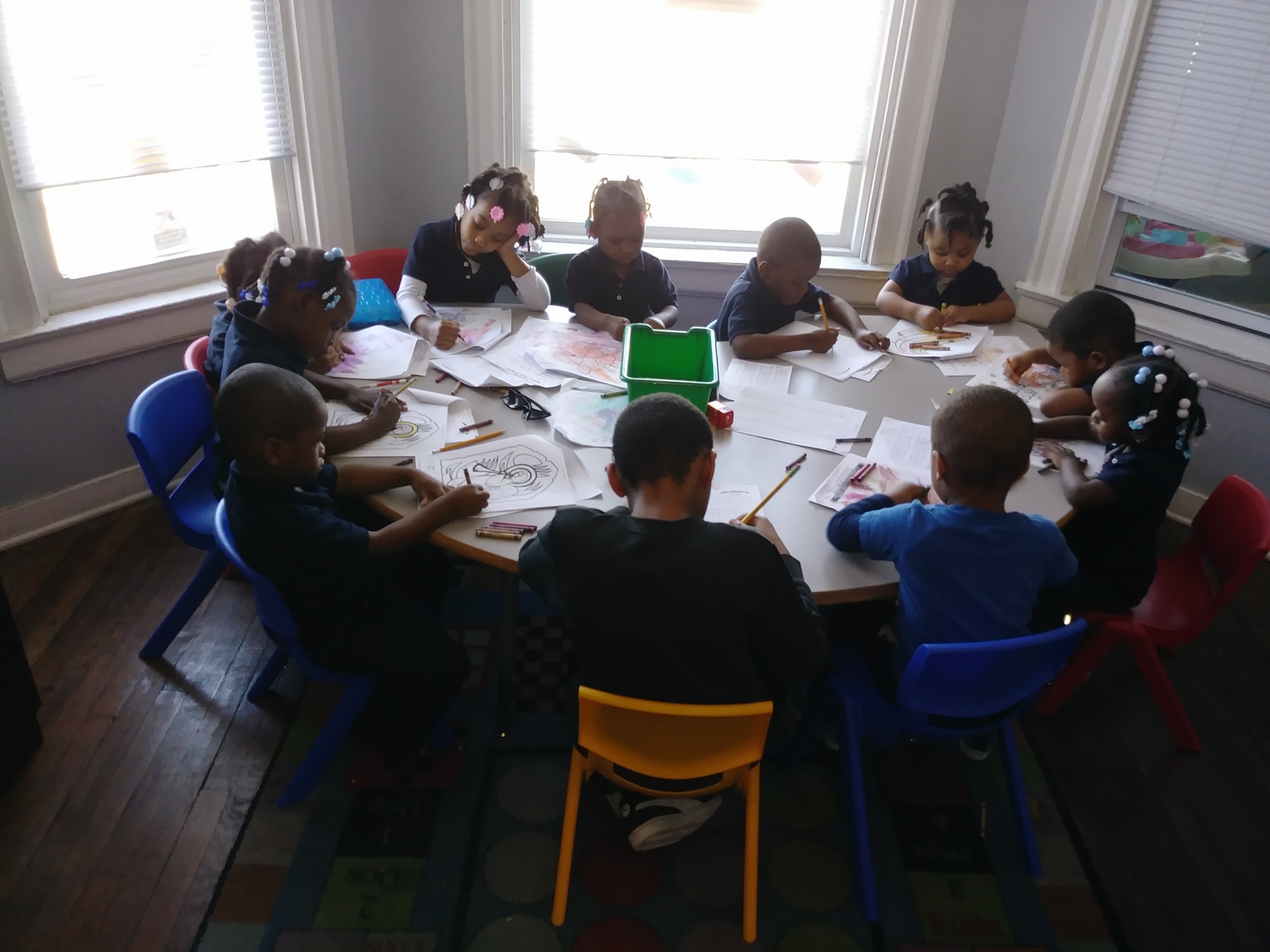 Kids Sitting Together At A Classroom Table