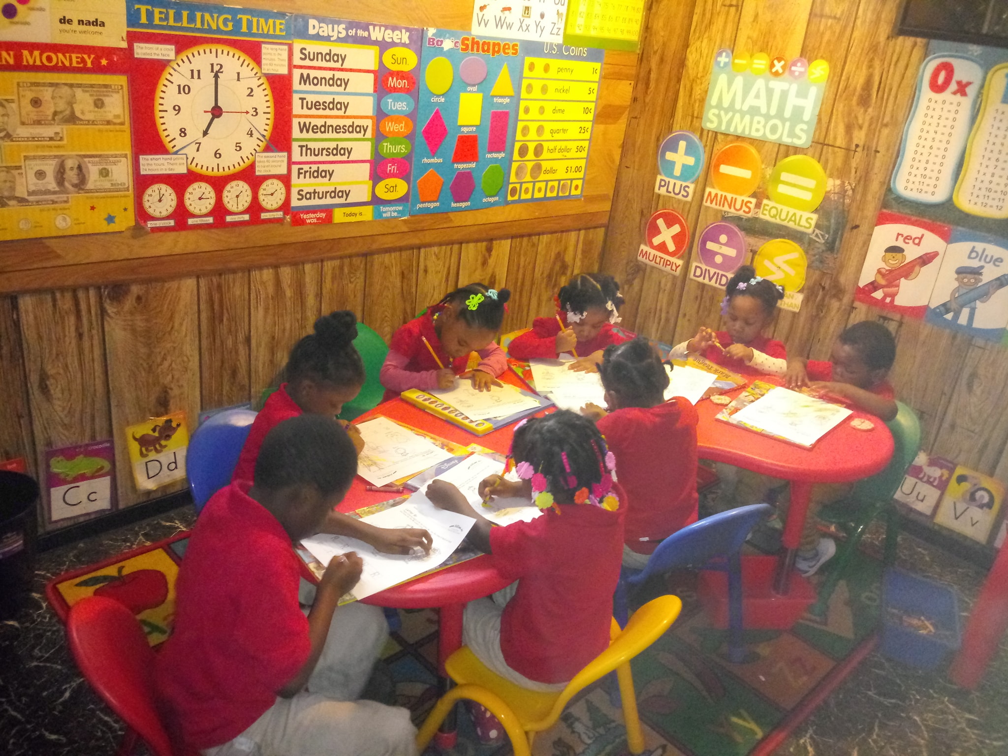 Children Sitting At A Table In A Classroom